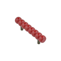 Compact cherry red beaded bar pull, angled view